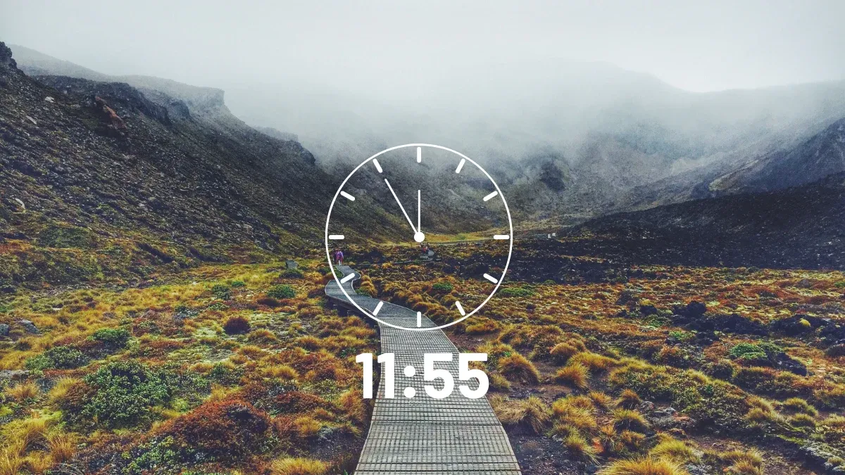 Clock face reading 11:55 over a misty mountain path